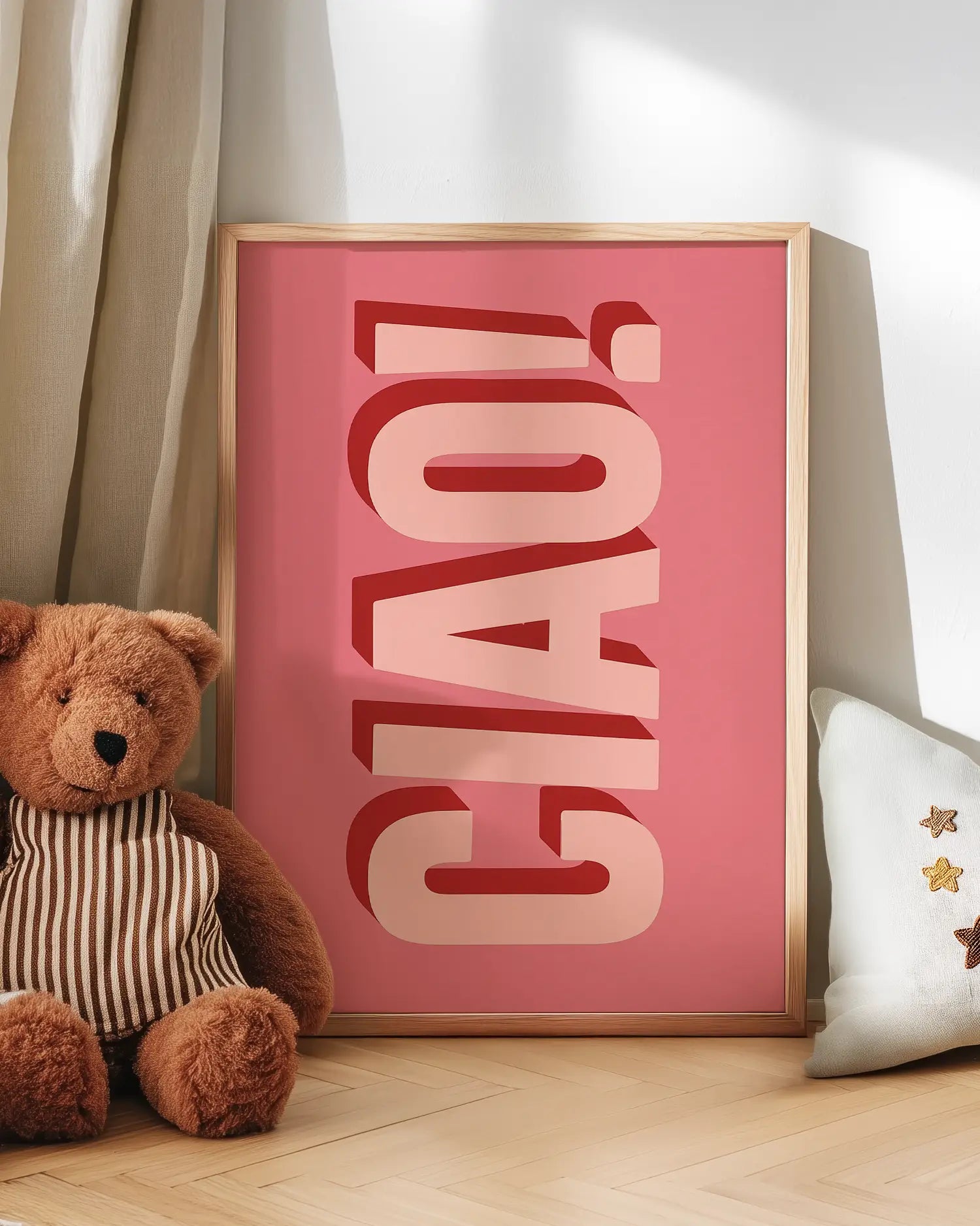 Pink artwork with 'CIAO!' text next to a teddy bear on a wooden floor.