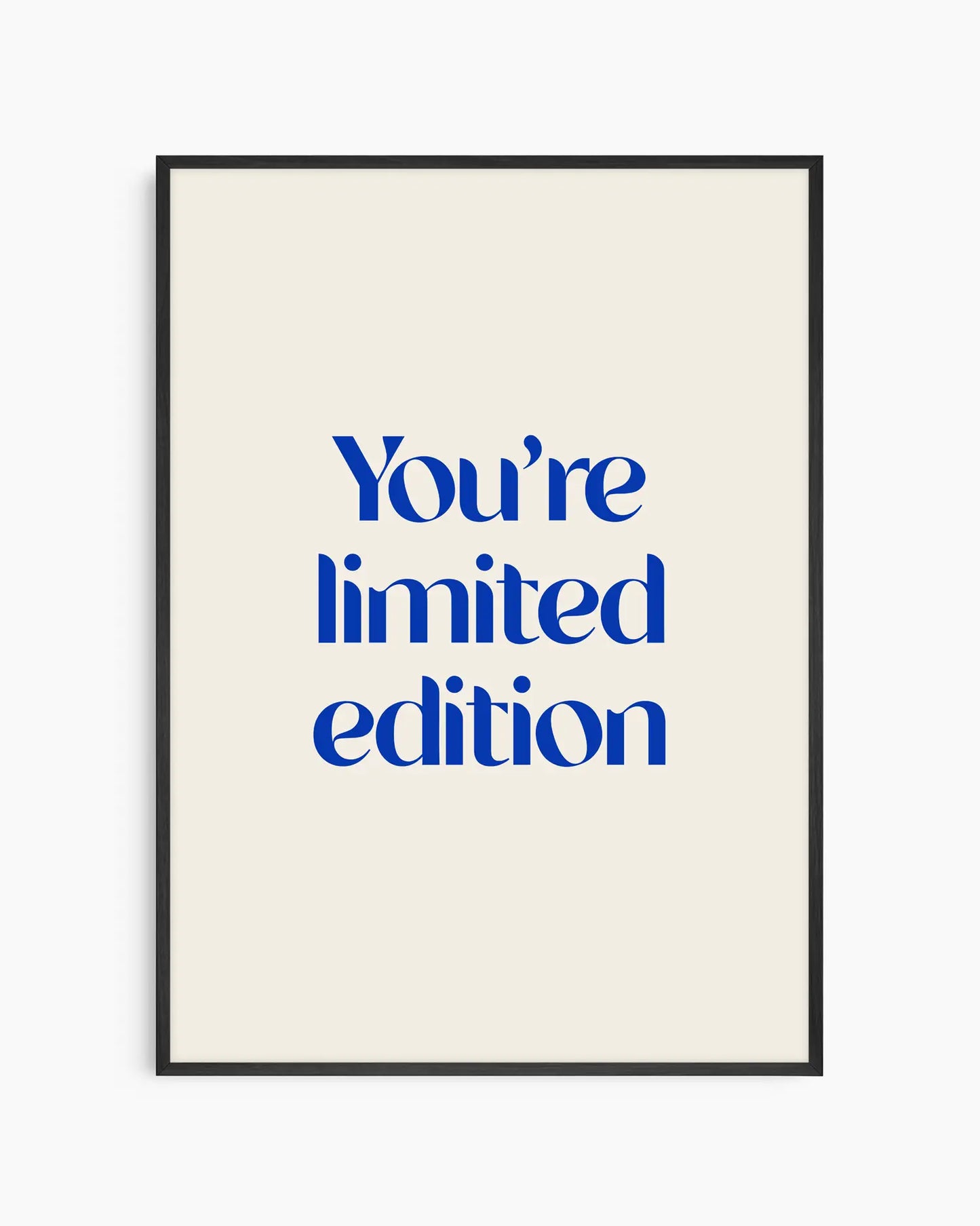 Nursery poster with 'You're limited edition' text in blue framed in a black wooden frame