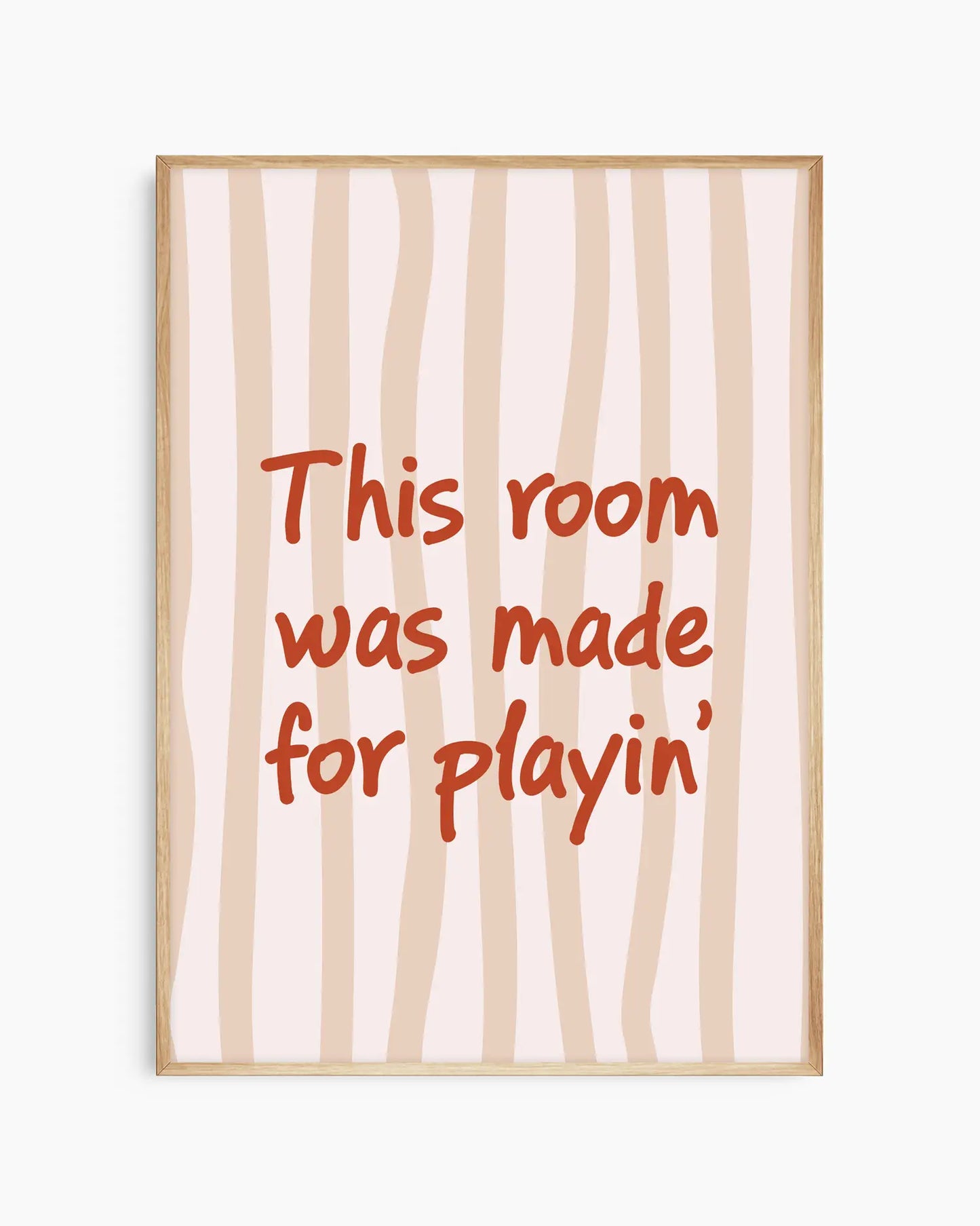 Nursery poster with text 'This room was made for playin'' on a beige striped background, framed in an oak wooden frame.