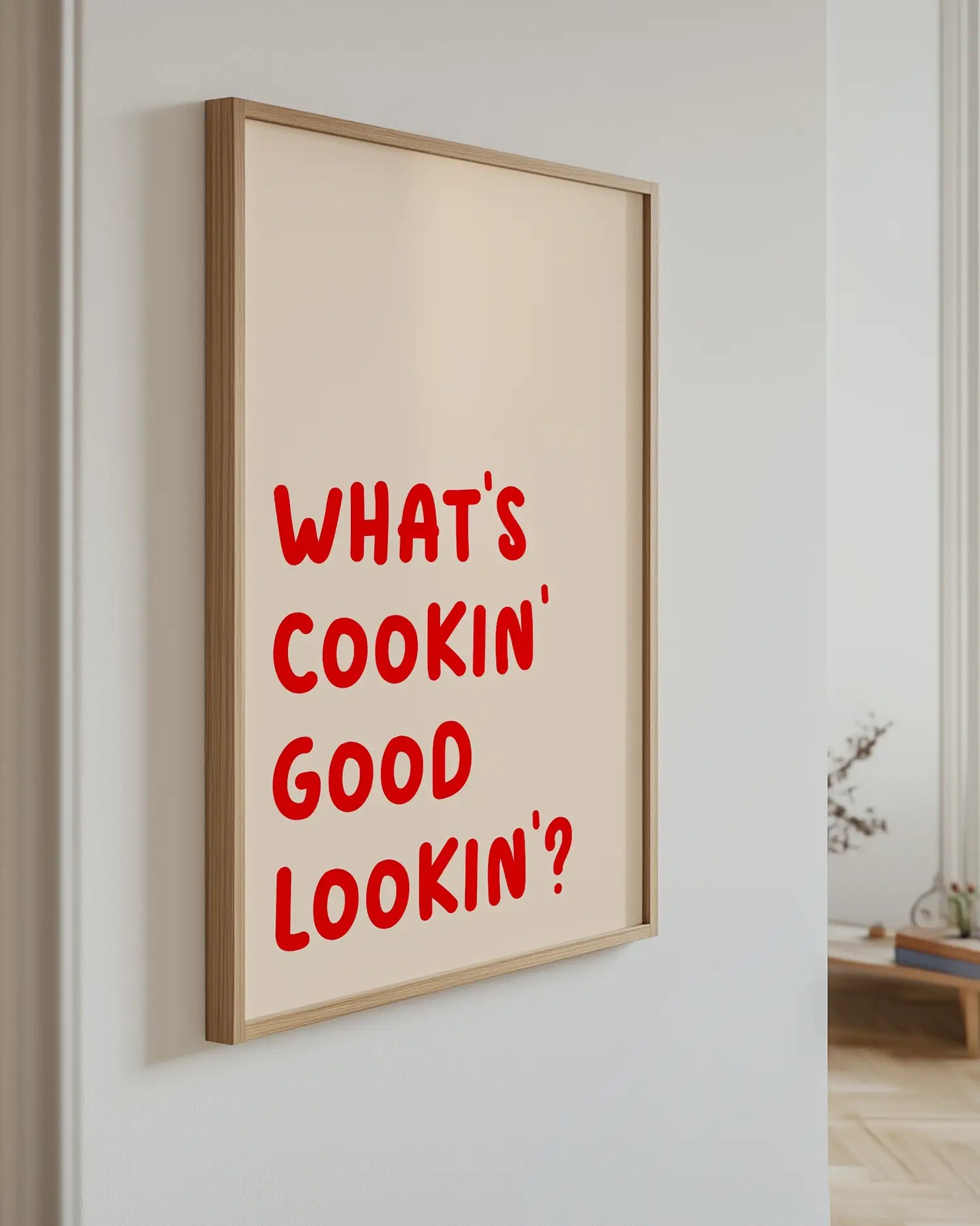 Poster with the text "What's cookin' good lookin'?" on the wall