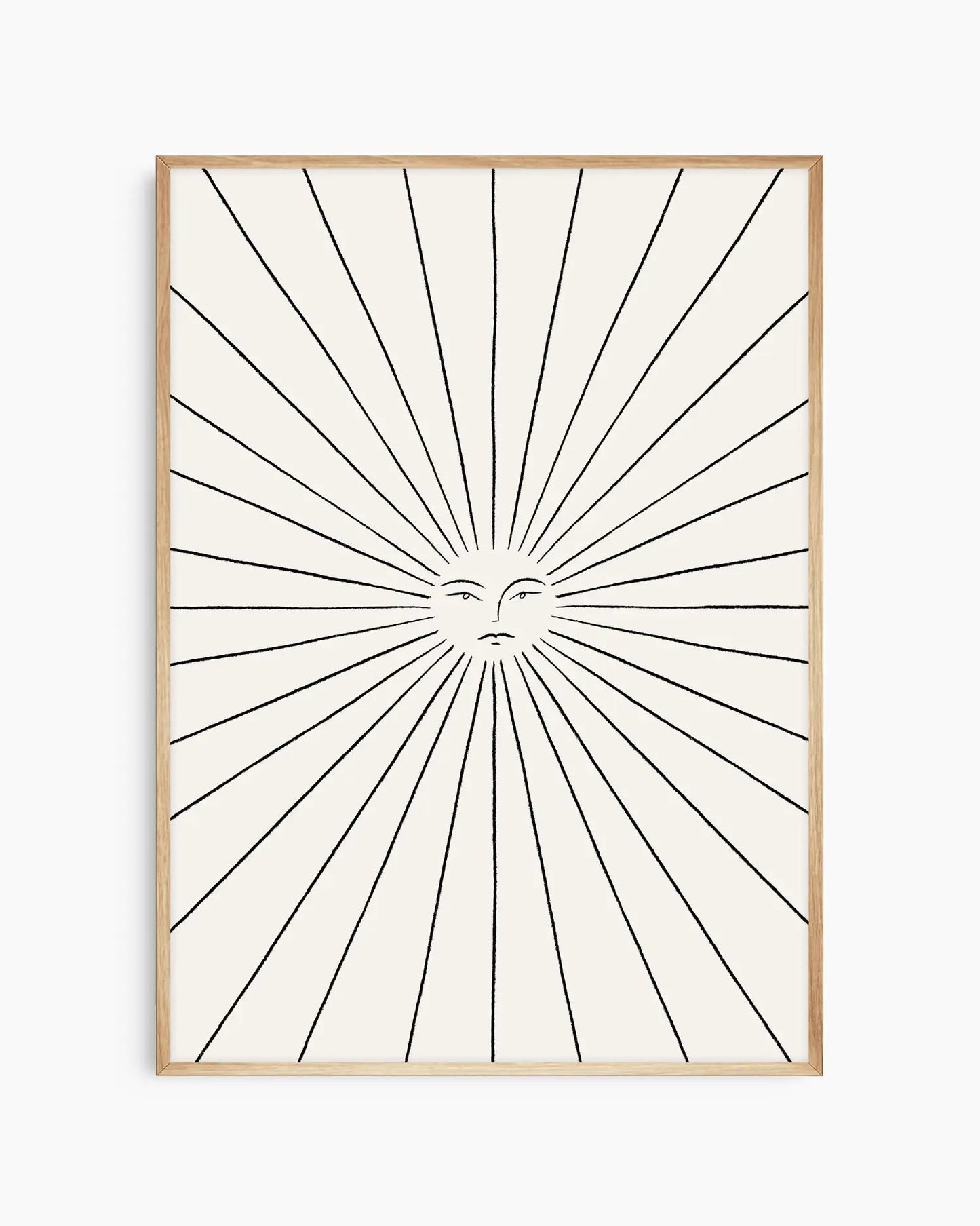 Framed artwork with sunburst design and face in center on white background