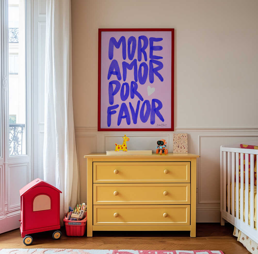 Framed nursery poster with purple text 'MORE AMOR POR FAVOR' hanging on a wall.