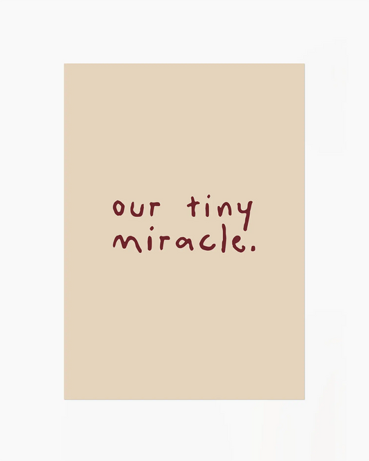 Beige nursery poster with 'our tiny miracle.' text in brown
