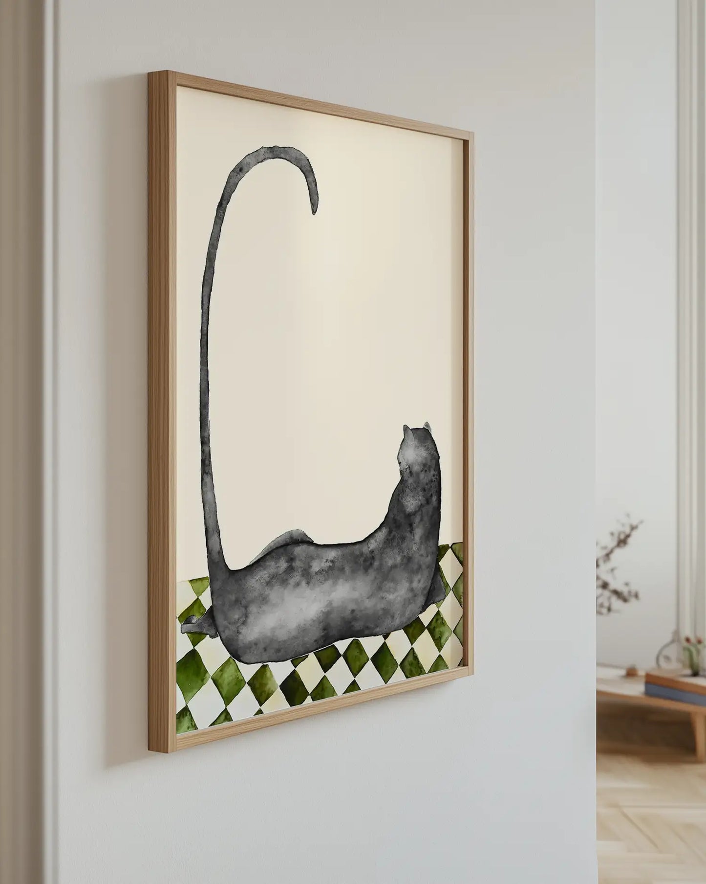 Framed artwork of a black panther on a checkered pattern wall in a room.