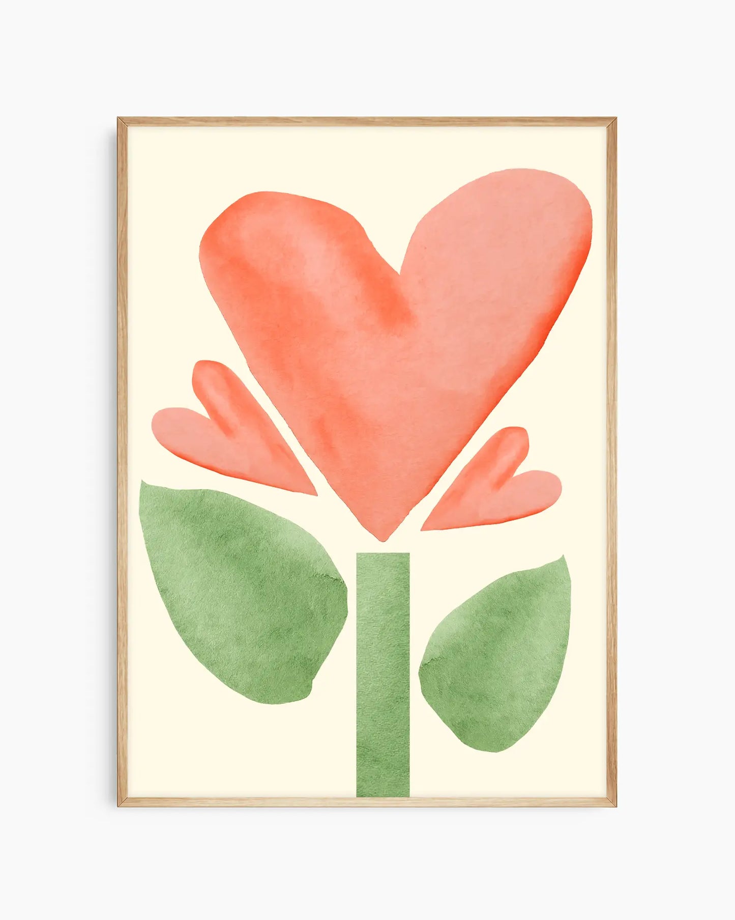 Framed artwork with a heart-shaped flower with green stem and leaves on a light yellow background