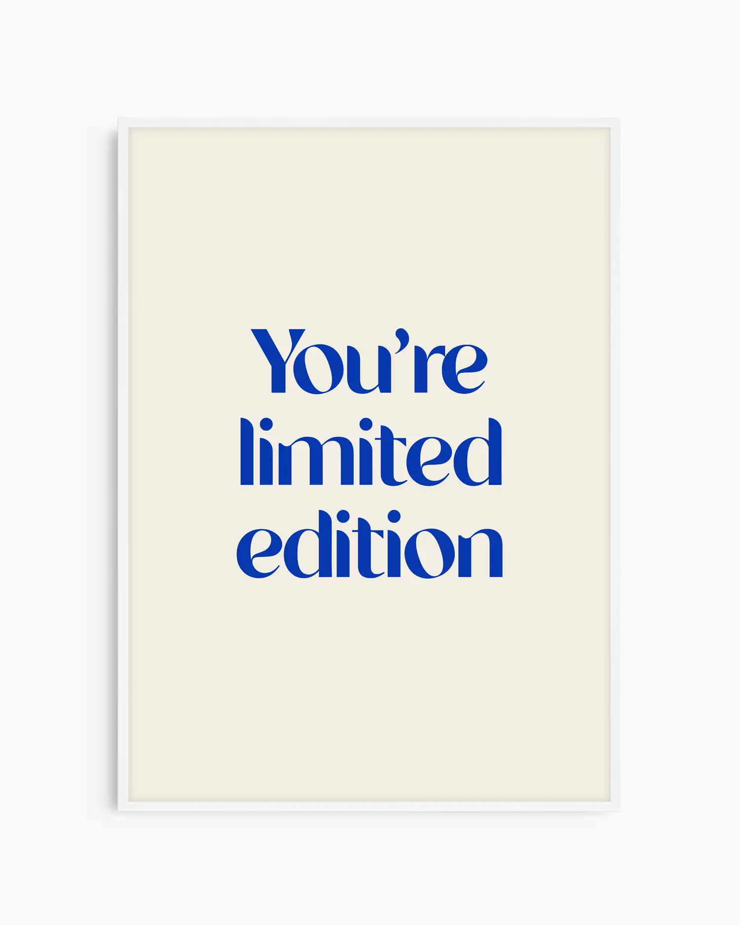 Nursery poster with 'You're limited edition' text in blue framed in a white wooden frame
