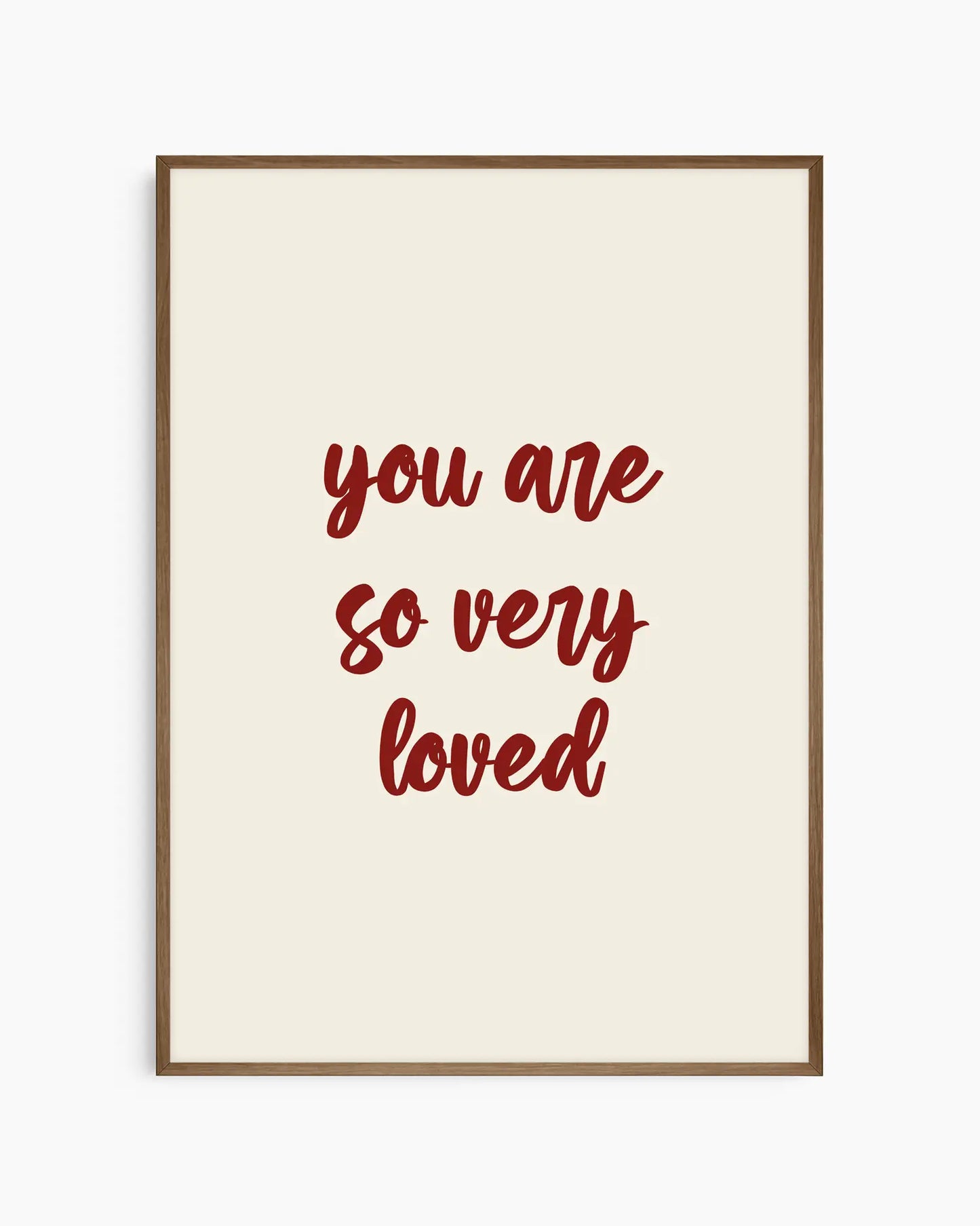 Nursery poster with red 'you are so very loved' text on a beige background. Dark oak frame.