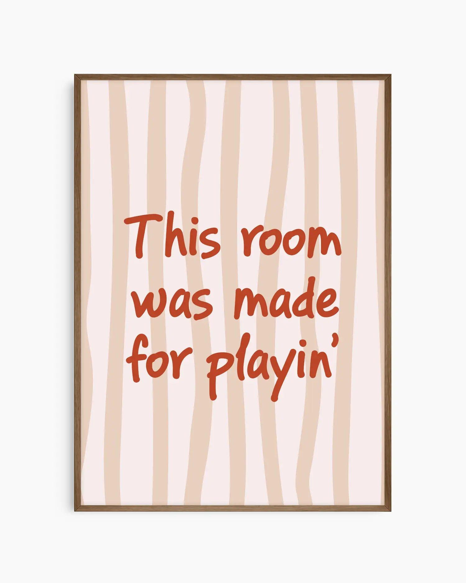 Nursery poster with text 'This room was made for playin'' on a beige striped background, framed in a dark oak wooden frame.