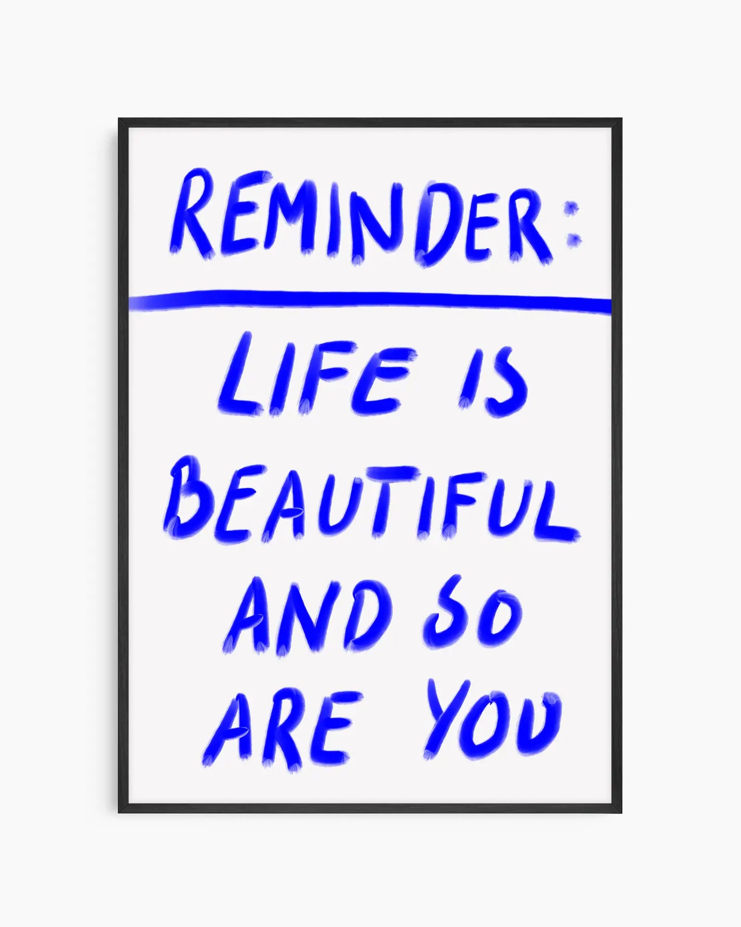 Framed poster with motivational quote 'Reminder: Life is beautiful and so are you' in blue text on a white background