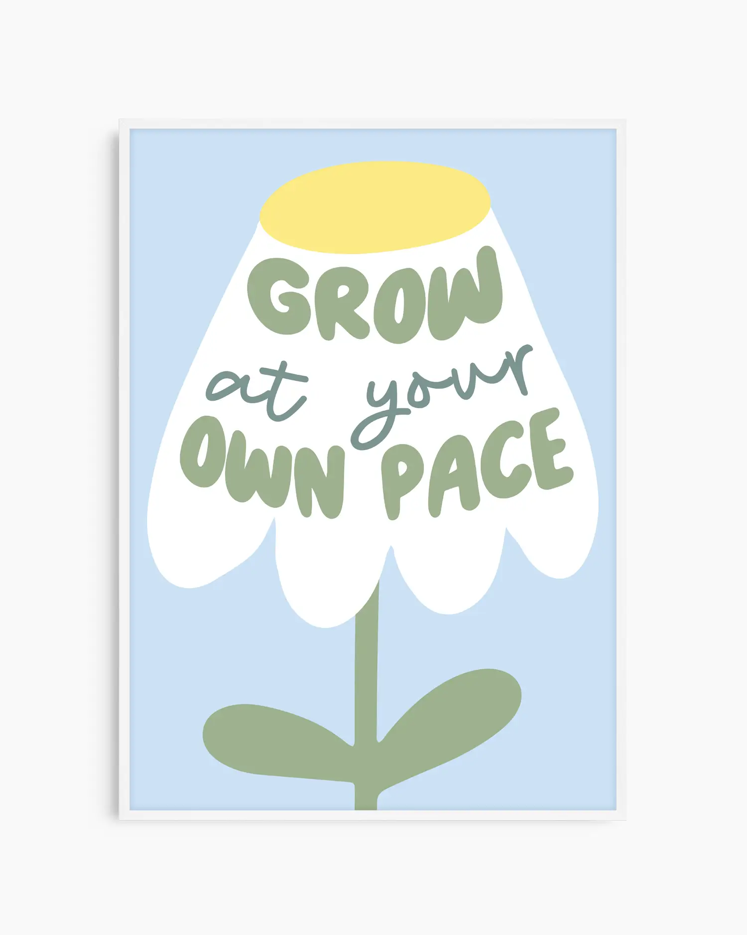 Framed artwork with a flower illustration and text 'Grow at your own pace' on a light blue background.