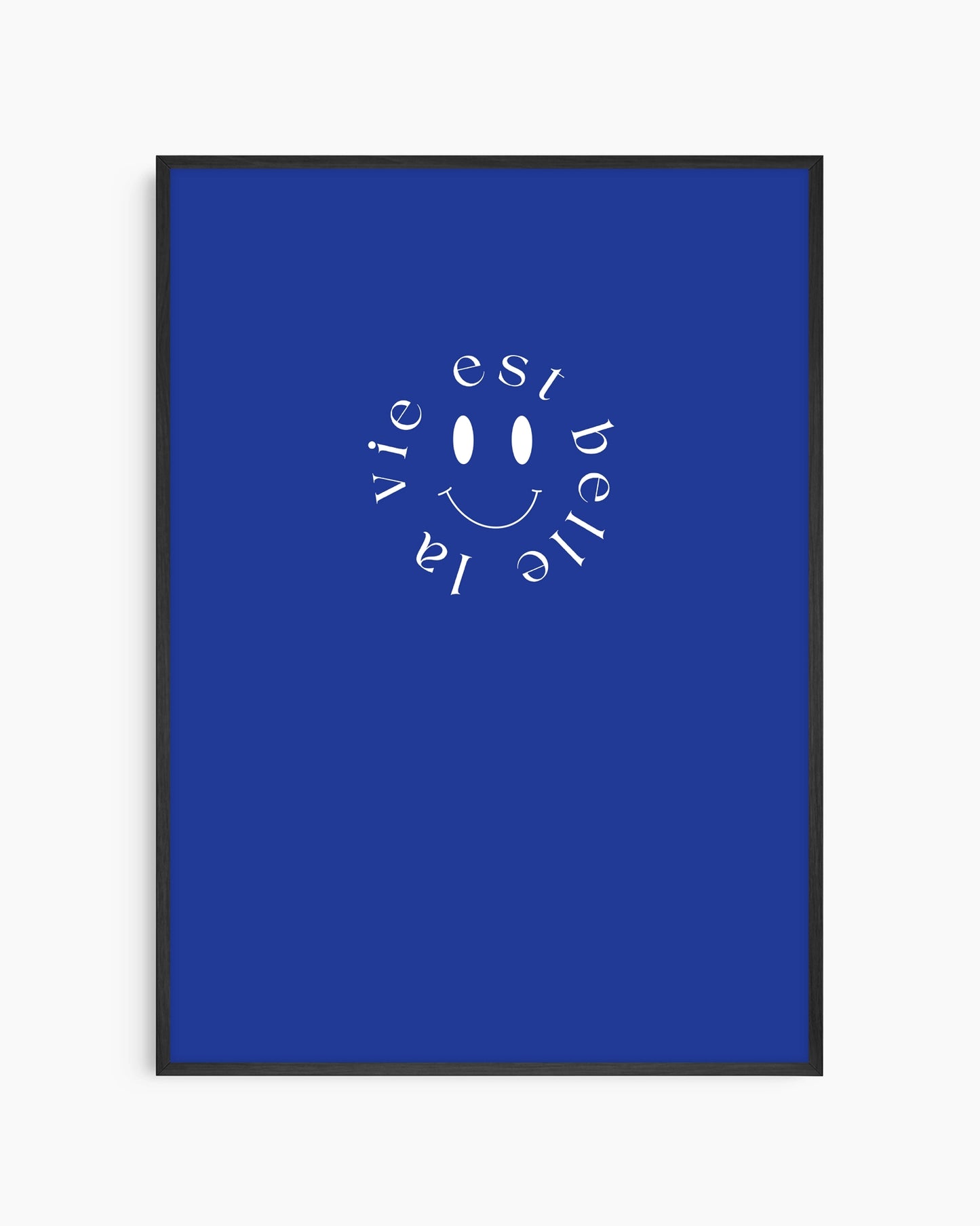 Framed poster with 'La vie est belle' text and smiley face on a blue background