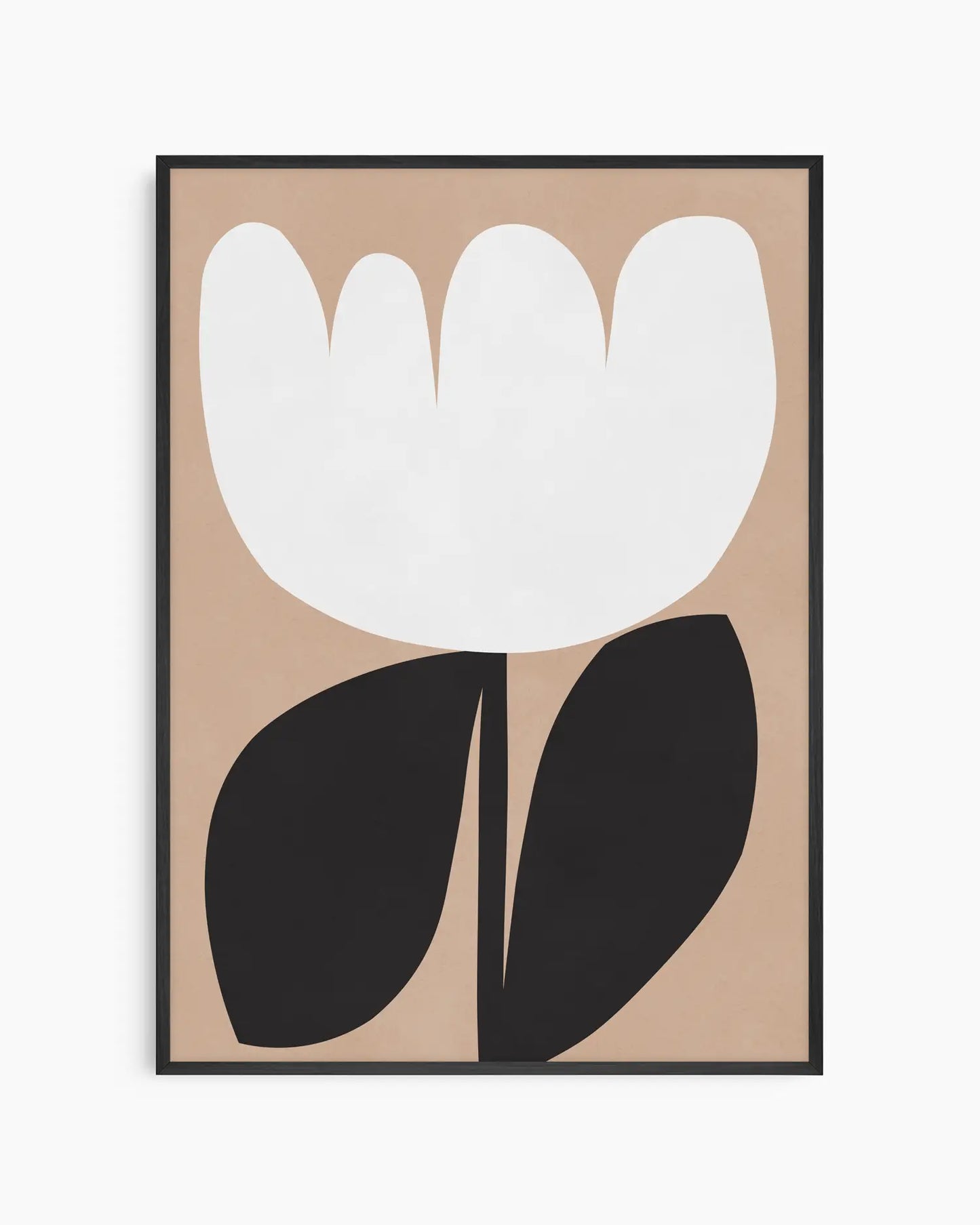 Framed artwork of a white flower with black leaves on a beige background