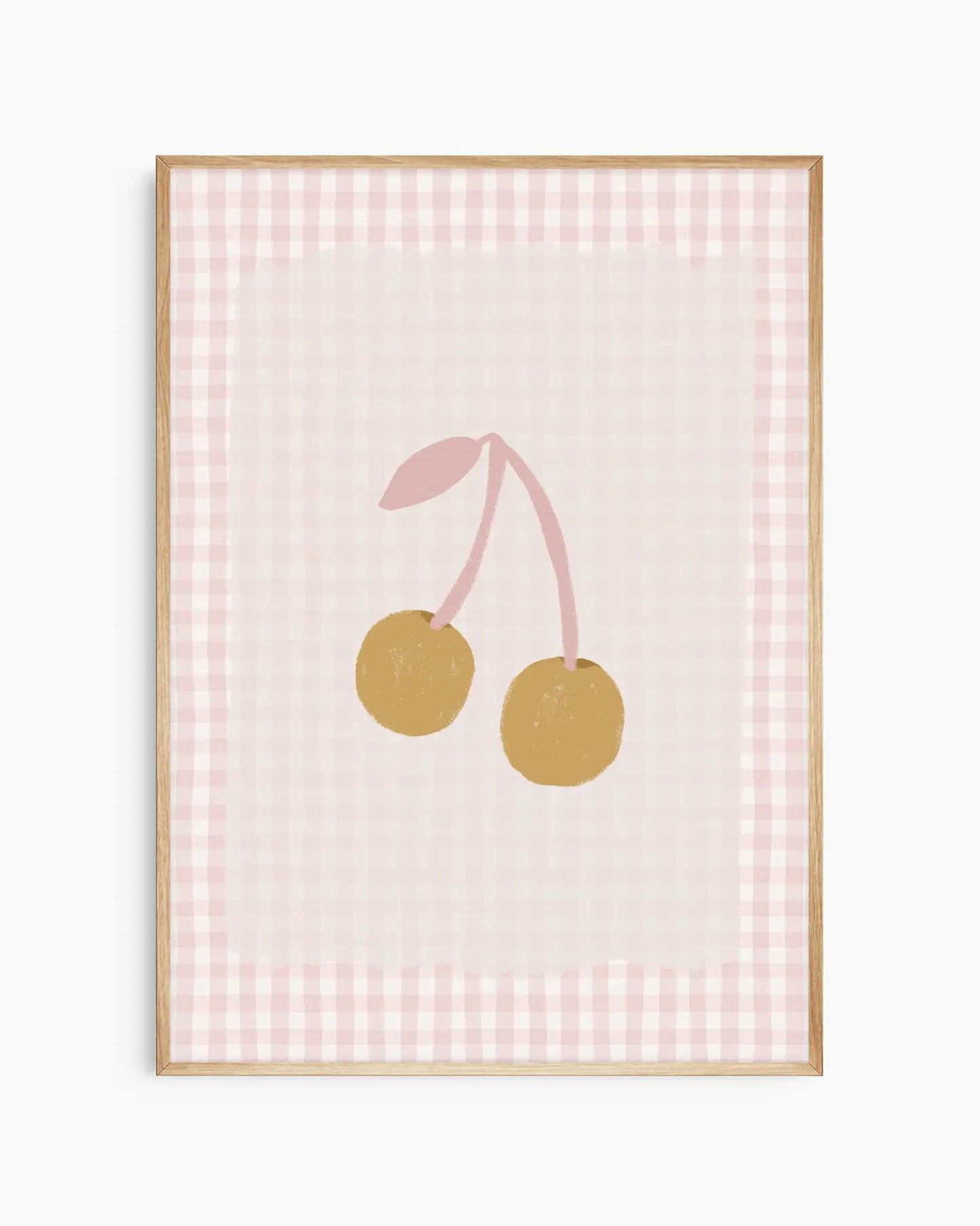 Framed artwork with two gold cherries on a pink checkered background