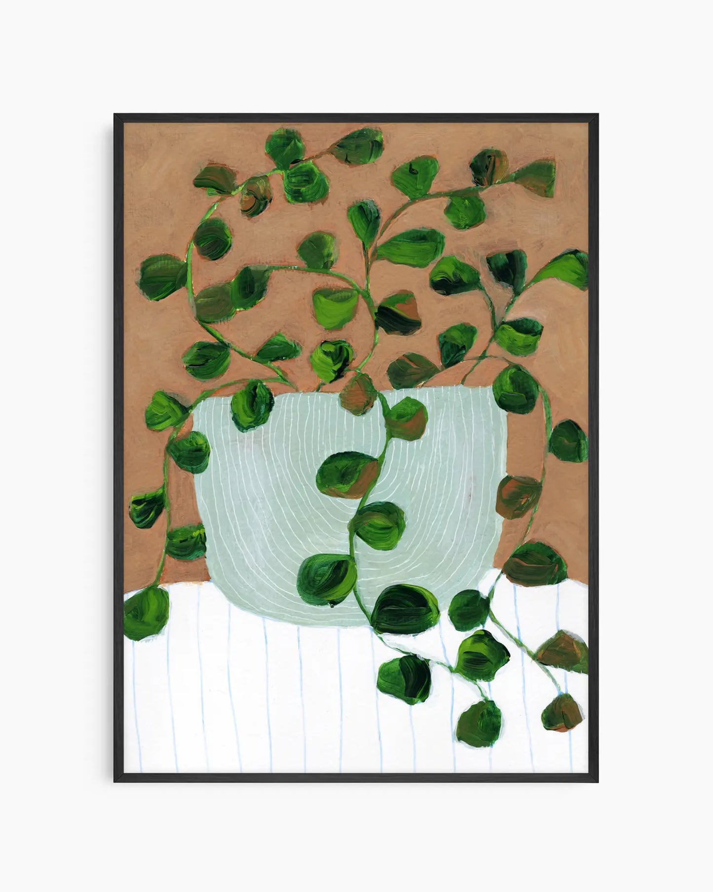 Framed artwork of a green plant in a white pot on a brown background