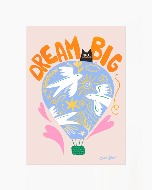 Nursery artwork with a colorful illustration of a hot air balloon, birds, and text "Dream big" on a light pink background. 